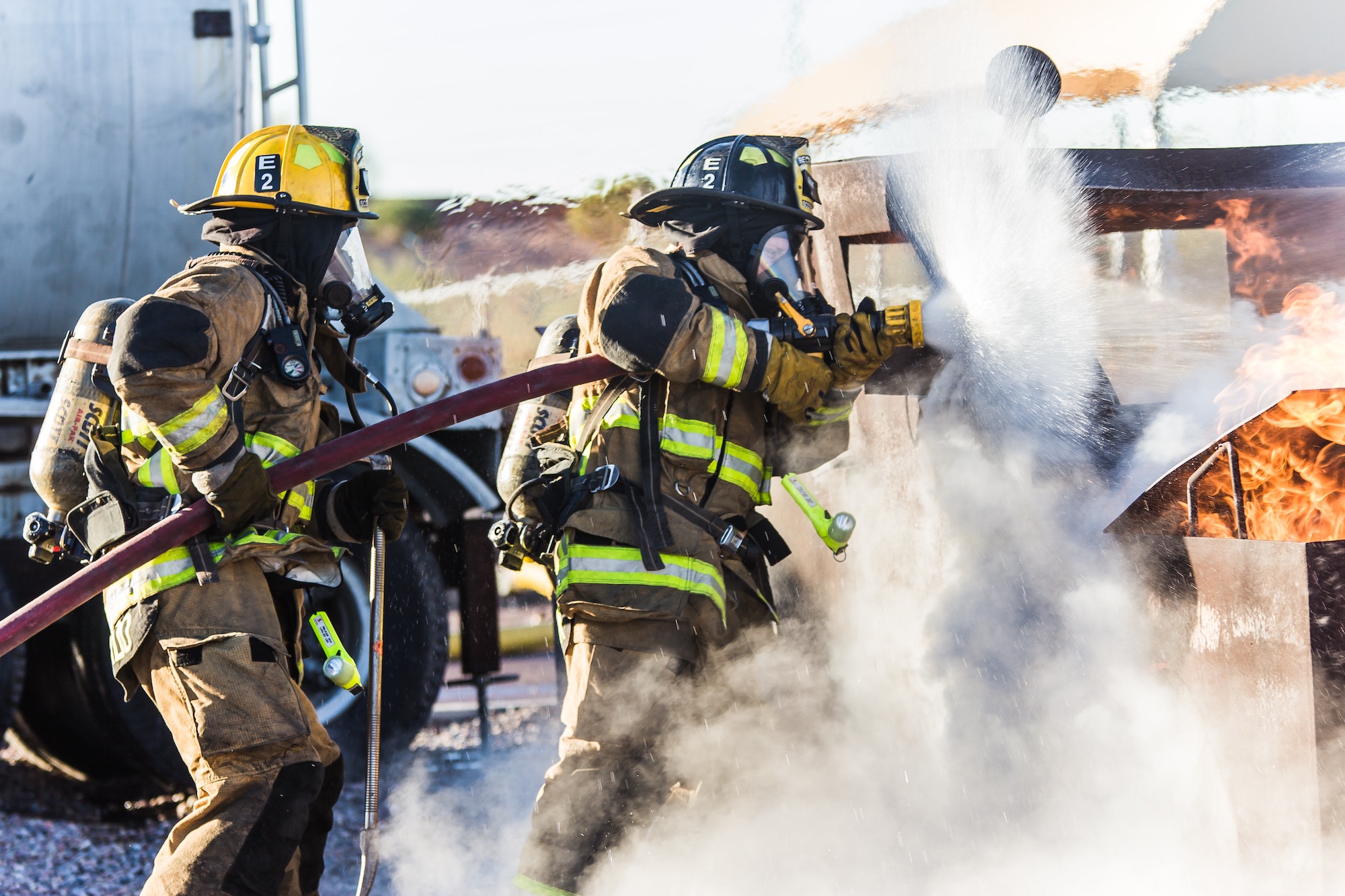 Firefighter in protective PPE gear, representing the importance of ISO 23616 standards for firefighter personal protective equipment inspection and maintenance