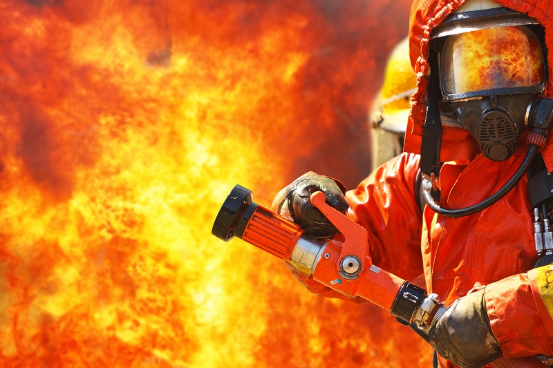 Oil and gas facility inspection using mobile device in hazardous area with flames visible