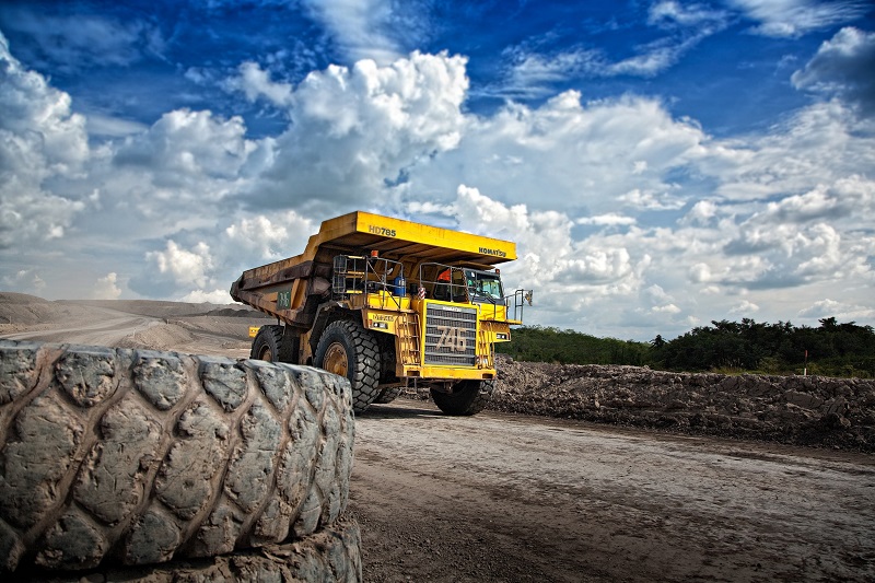 Large haul truck on a mine site road, electronic safety logbooks capture pre-shift inspection data for every vehicle
