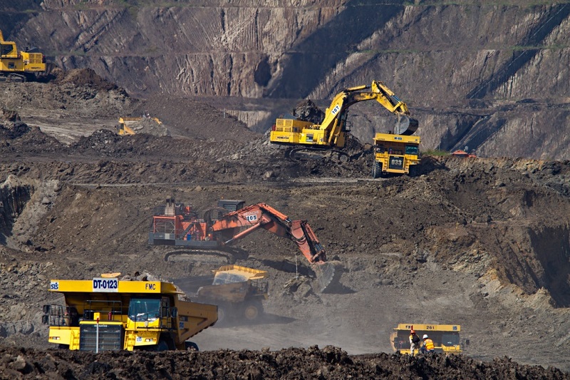 Heavy mining vehicles and mobile equipment on an open-cut mine site ready for pre-shift inspection