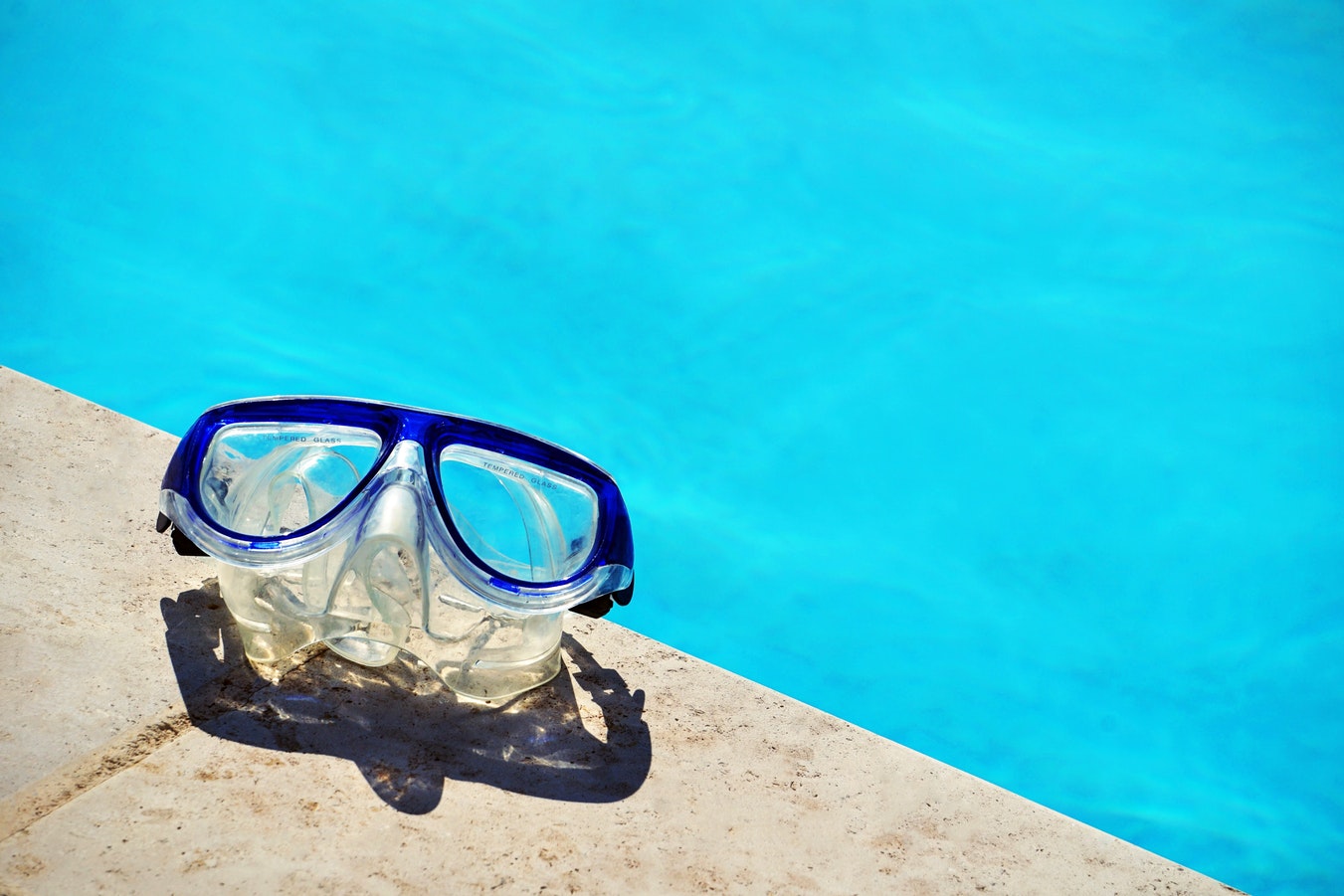 Pool safety inspector checking fencing and barriers at a residential swimming pool