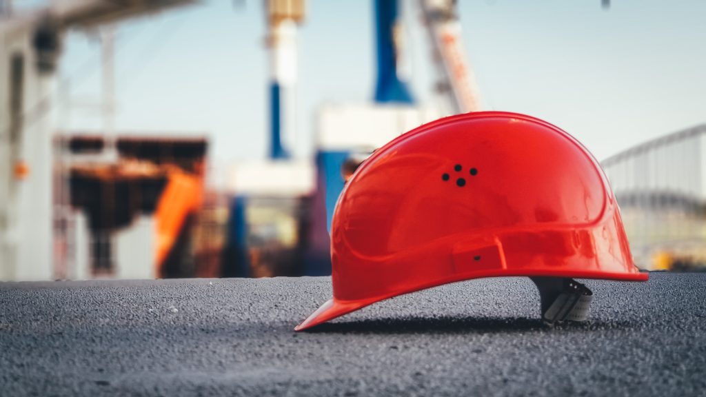 Team of workers adapting safety inspection processes in a dynamic industrial workplace